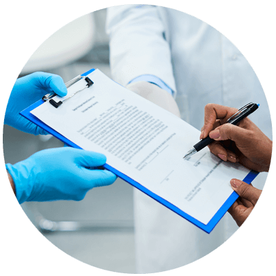 patient filling out forms in procedure room