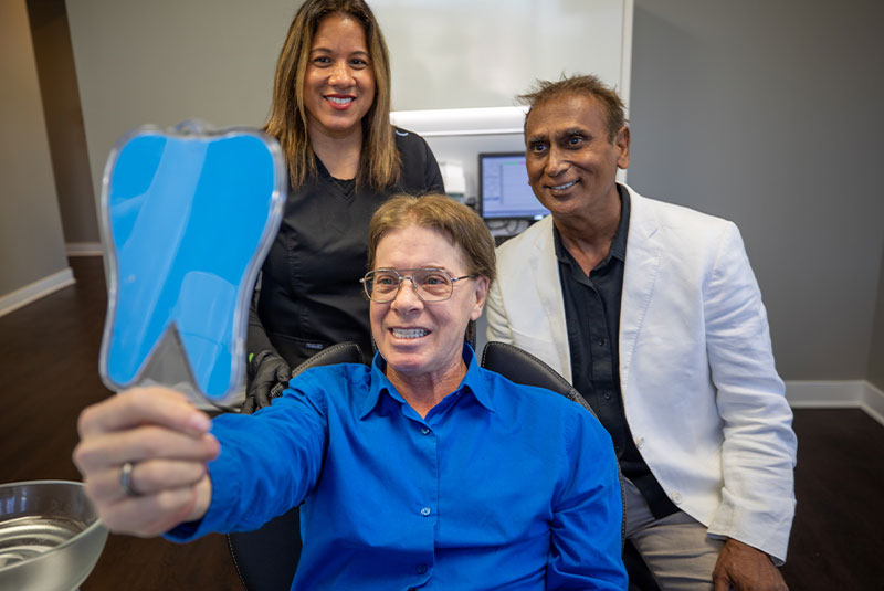 Patient smiling confidently after their dental procedure